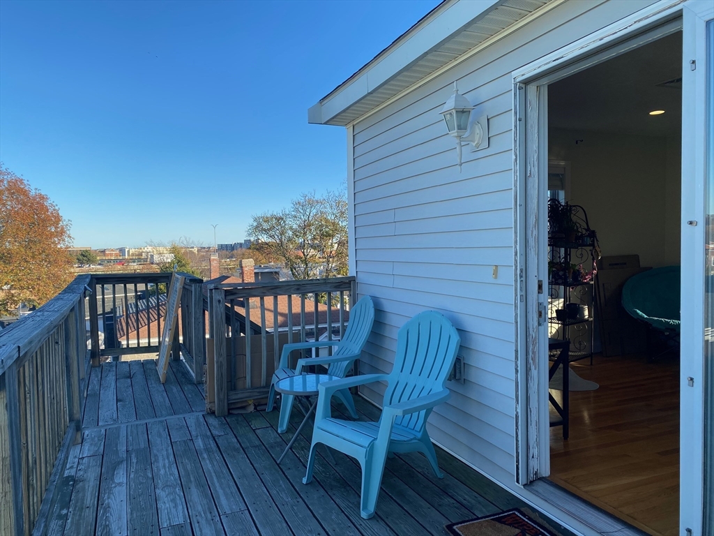 a view of a chairs on the roof deck