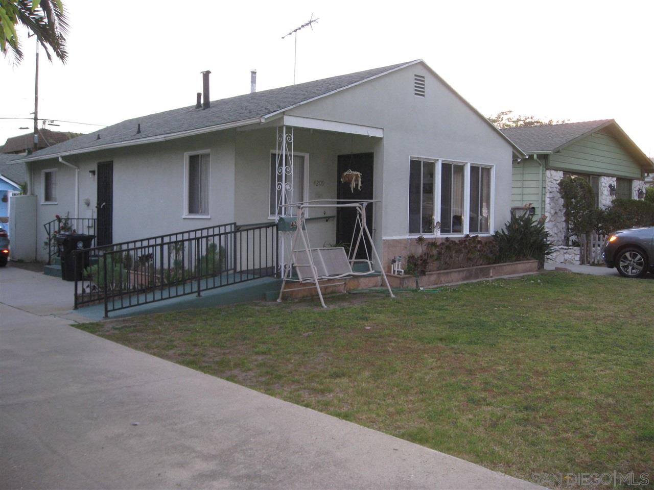 a view of a house with a yard