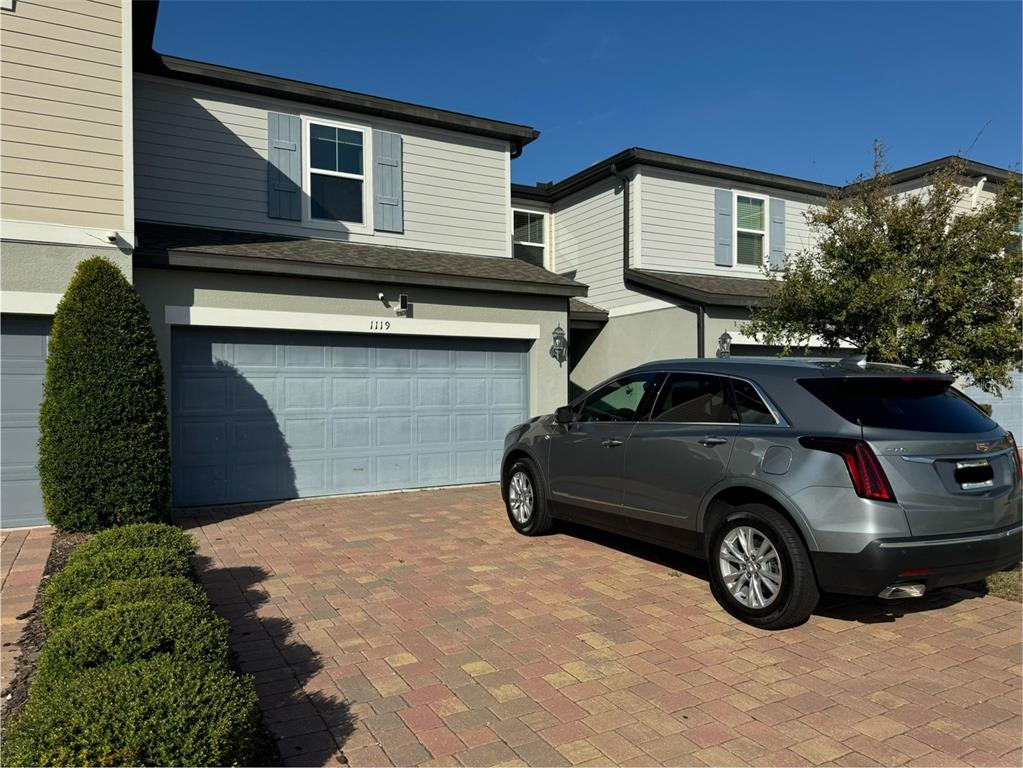 a car parked in front of a house