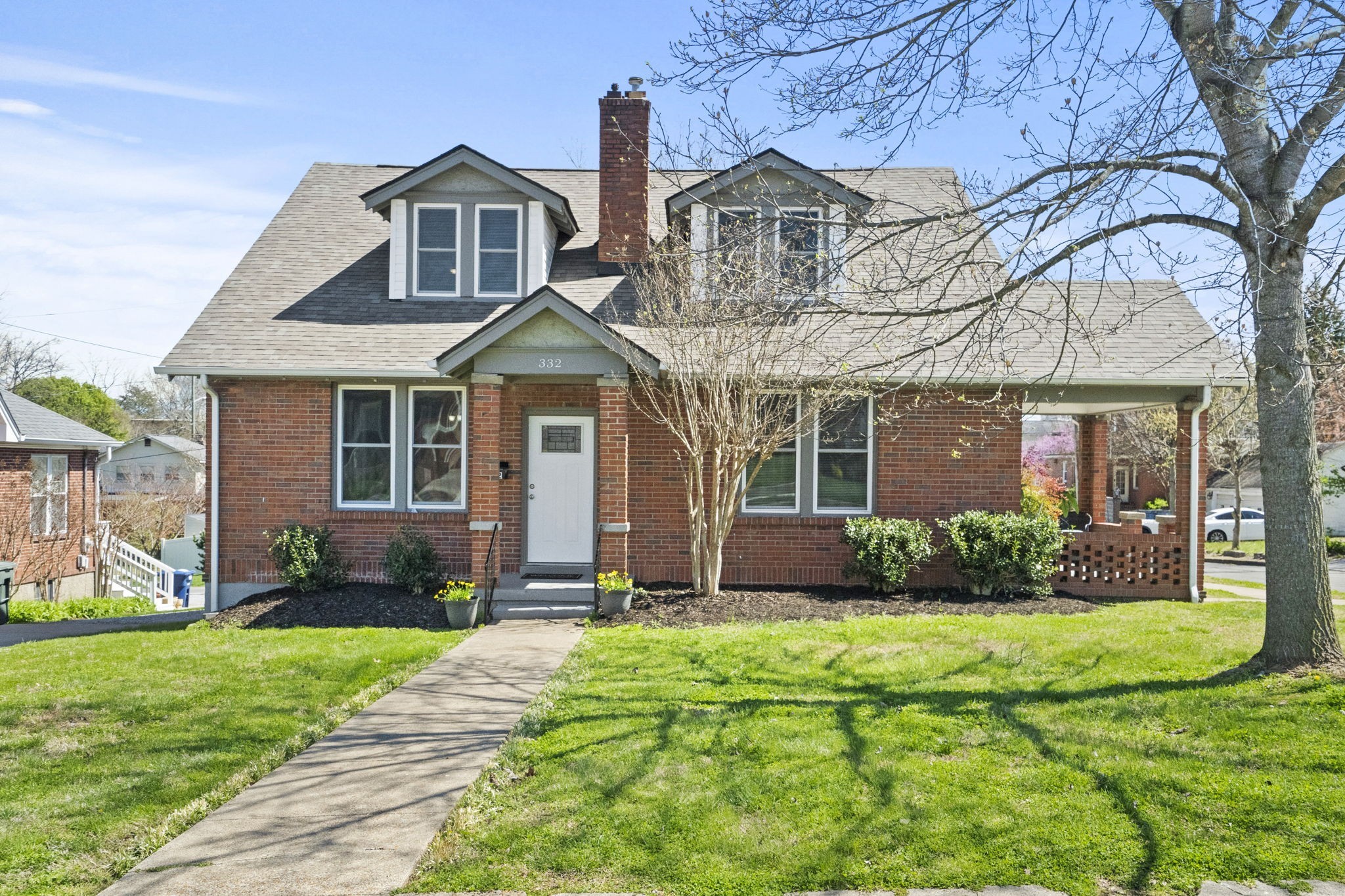 a front view of a house with a yard