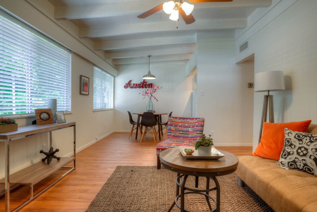 a living room with furniture and a table