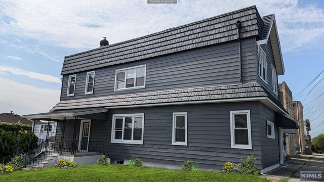 a brick house with lots of windows on it