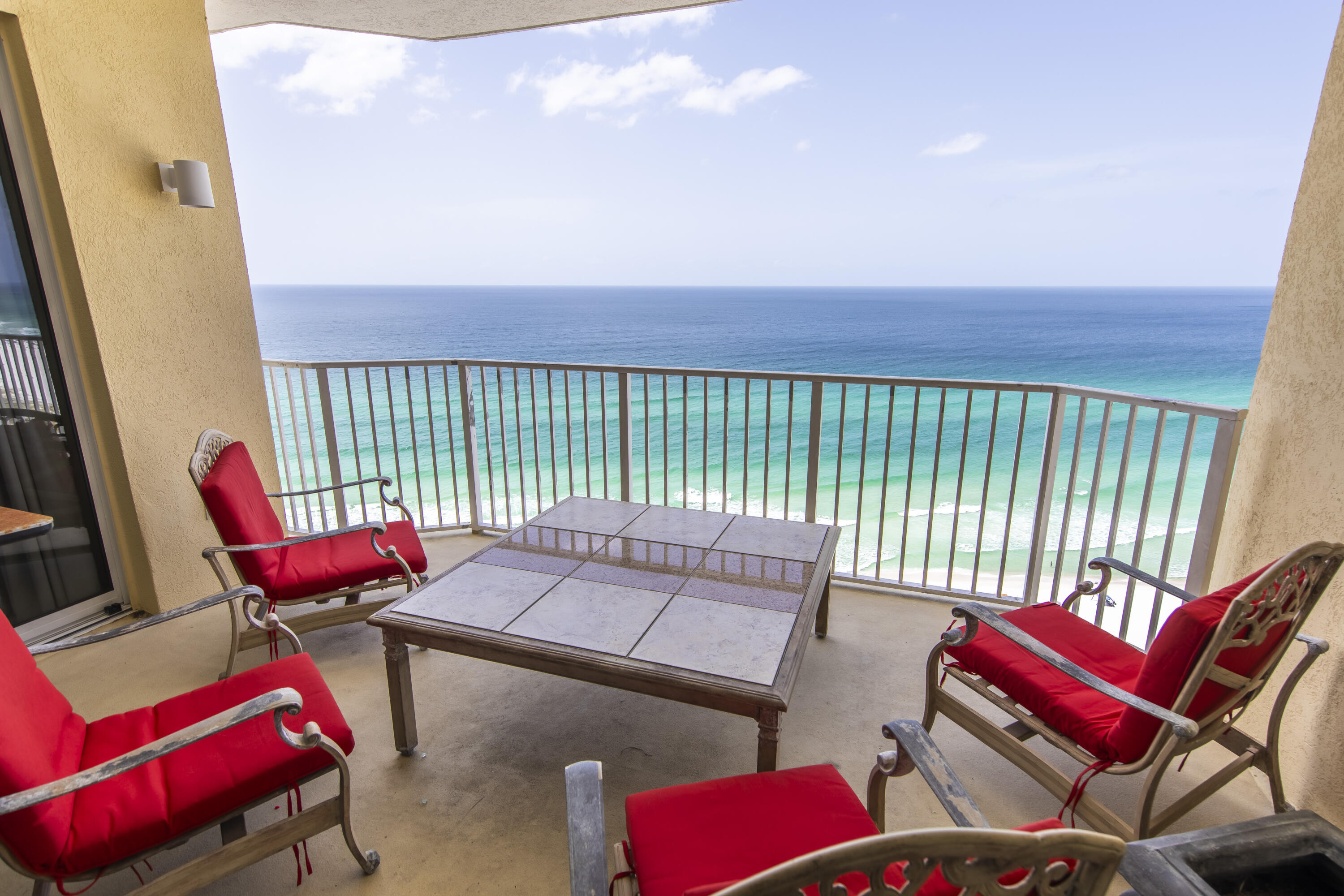 a view of a chairs and table in patio