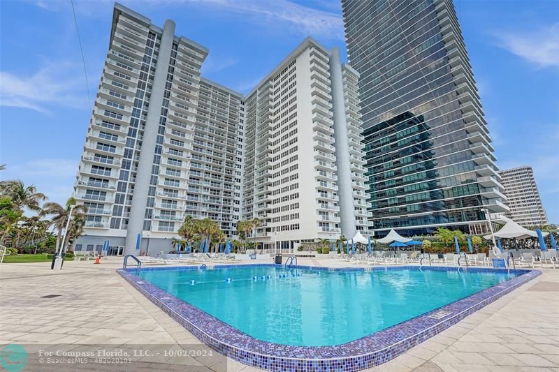 a view of a swimming pool with a lounge chairs