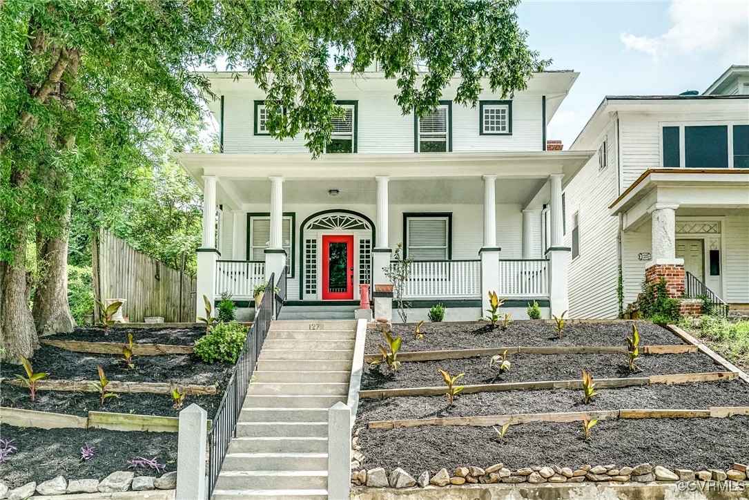 a front view of a house with garden