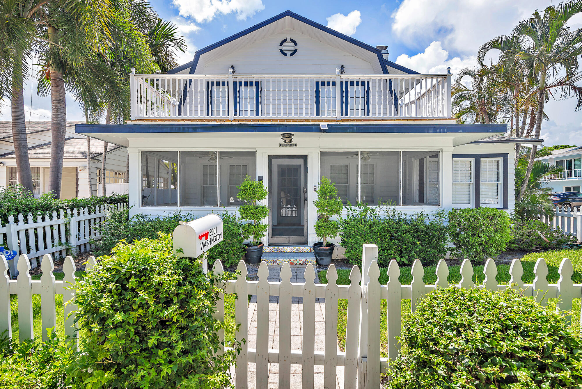 front view of a house with a garden