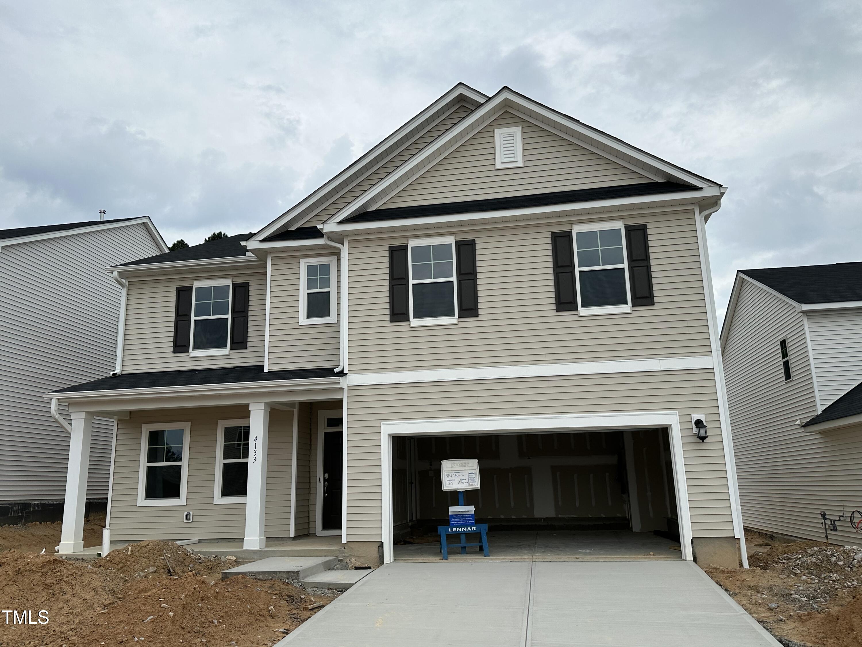 a front view of a house with a garage