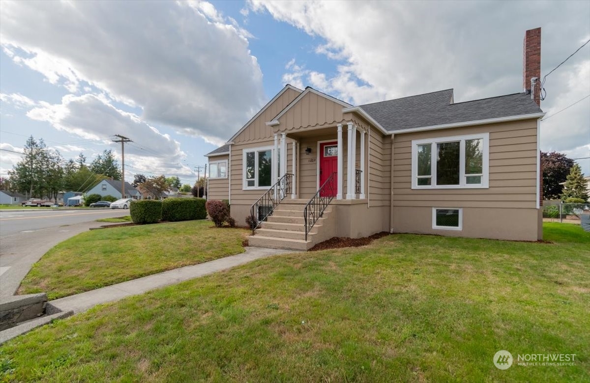 a view of house with yard and entertaining space