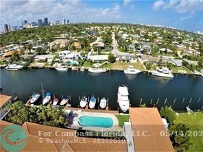 an aerial view of a house with a lake view