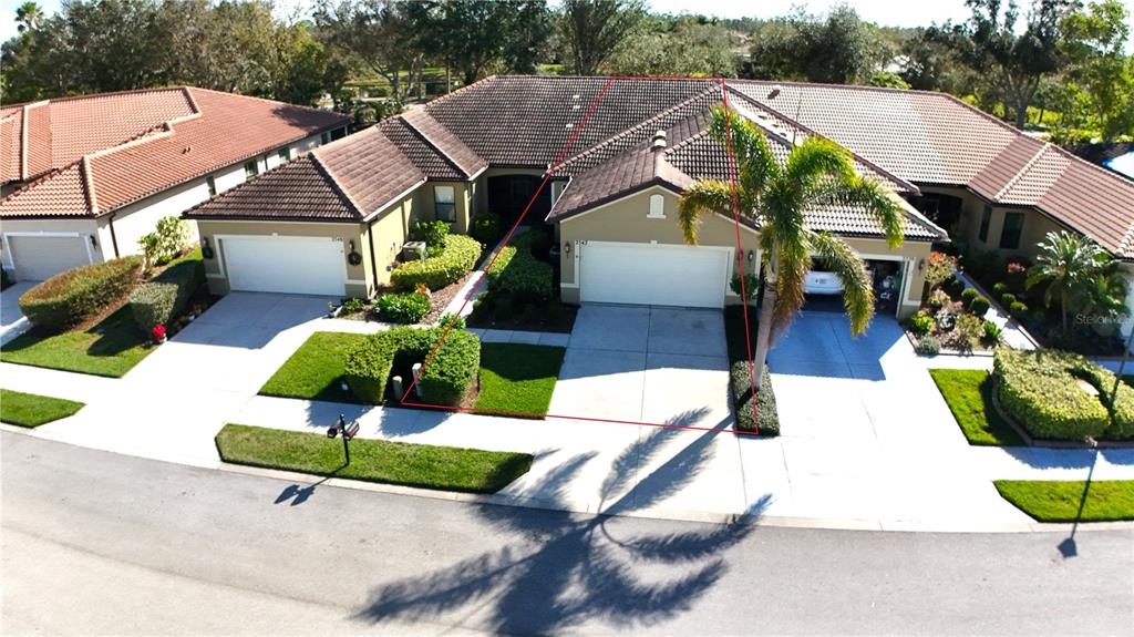 a aerial view of a house with swimming pool