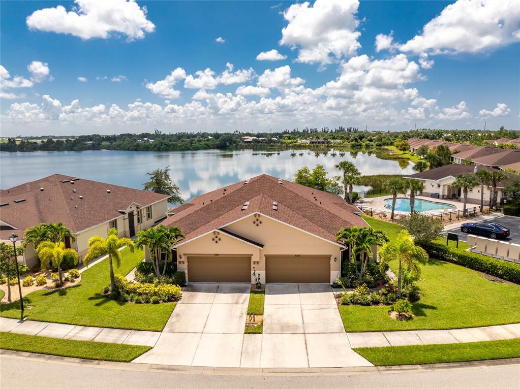 a view of a lake with a house in the background