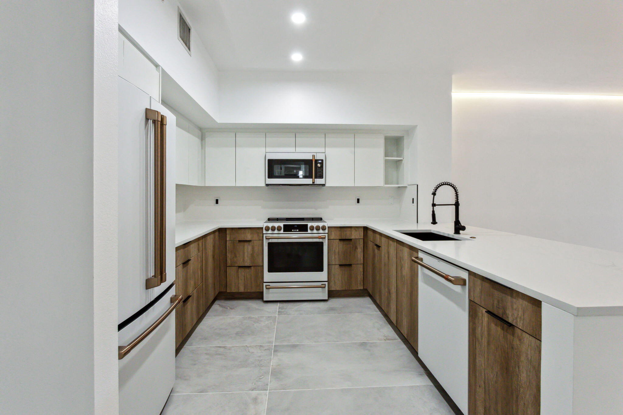 a kitchen with a sink and appliances