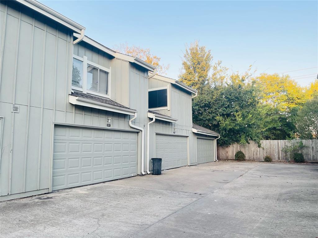 a view of garage and yard