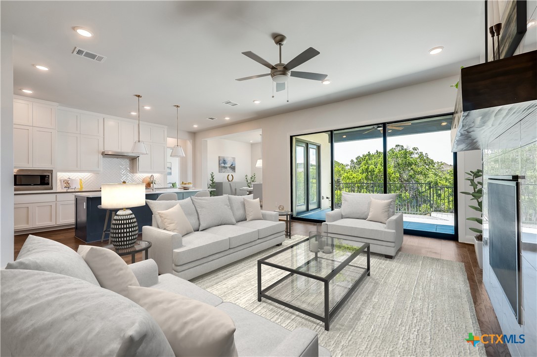 a living room with furniture and a large window