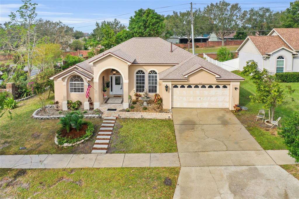 a front view of a house with garden