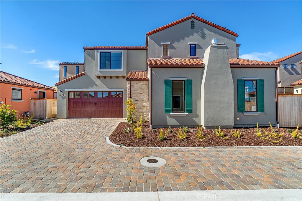 a front view of a house with entertaining space