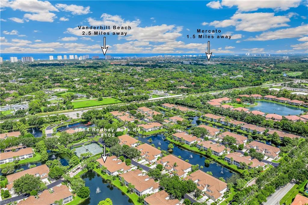 Aerial view featuring a water view. Showing property proximity to Vanderbilt Beach and Mercato shopping/restaurants