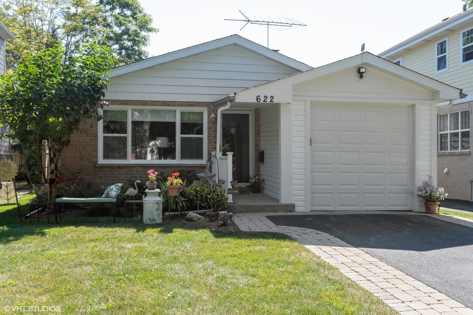 a front view of a house with garden