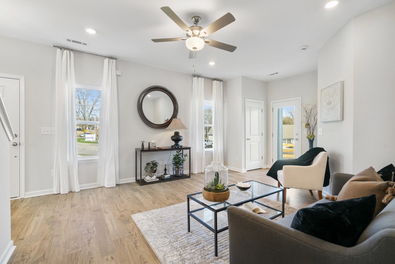 a living room with furniture and a fireplace