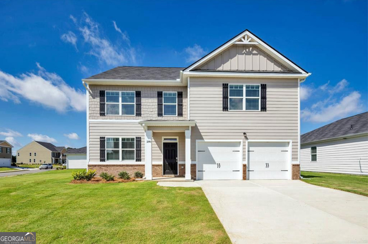 a front view of a house with a yard