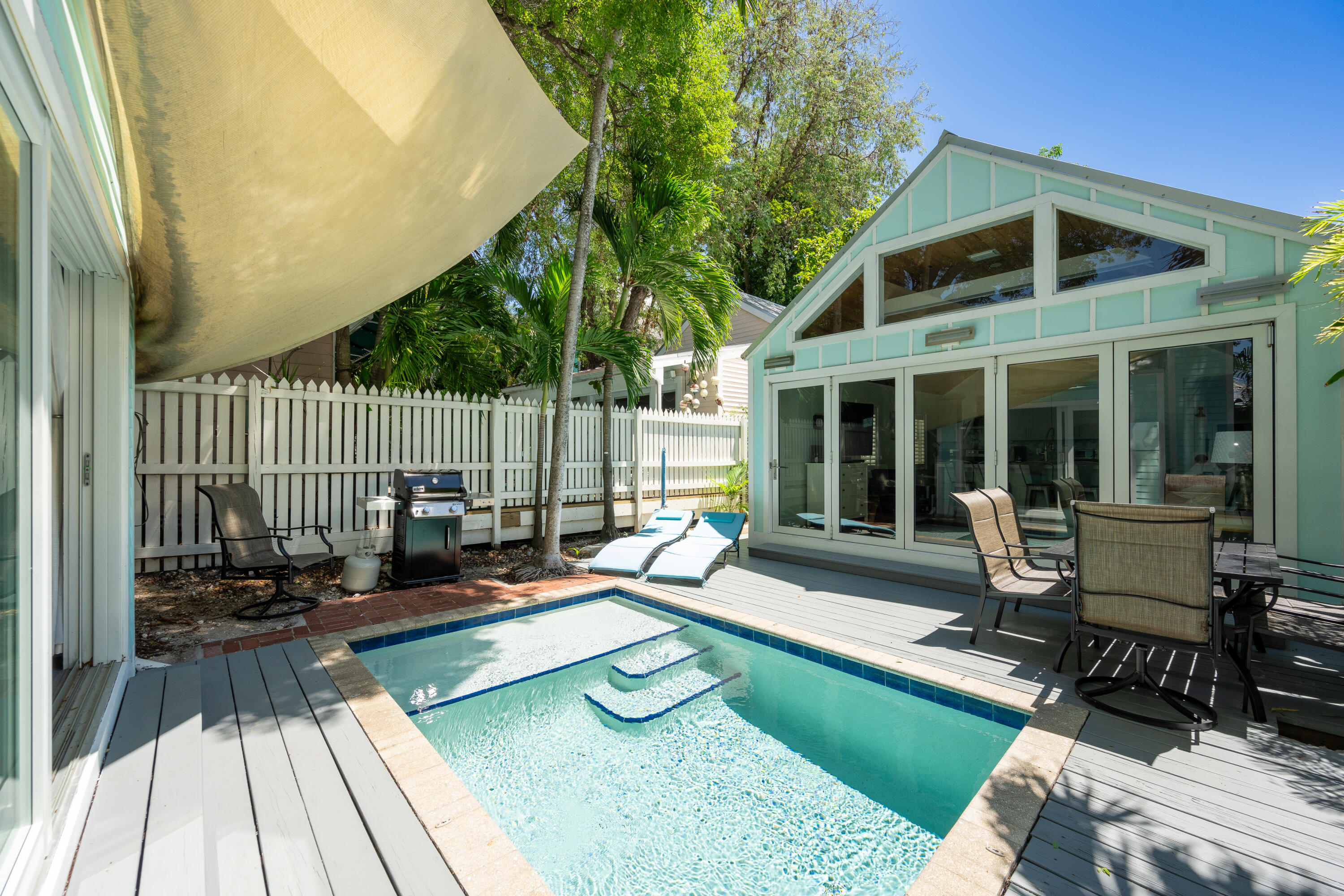 a view of a house with backyard sitting area and porch