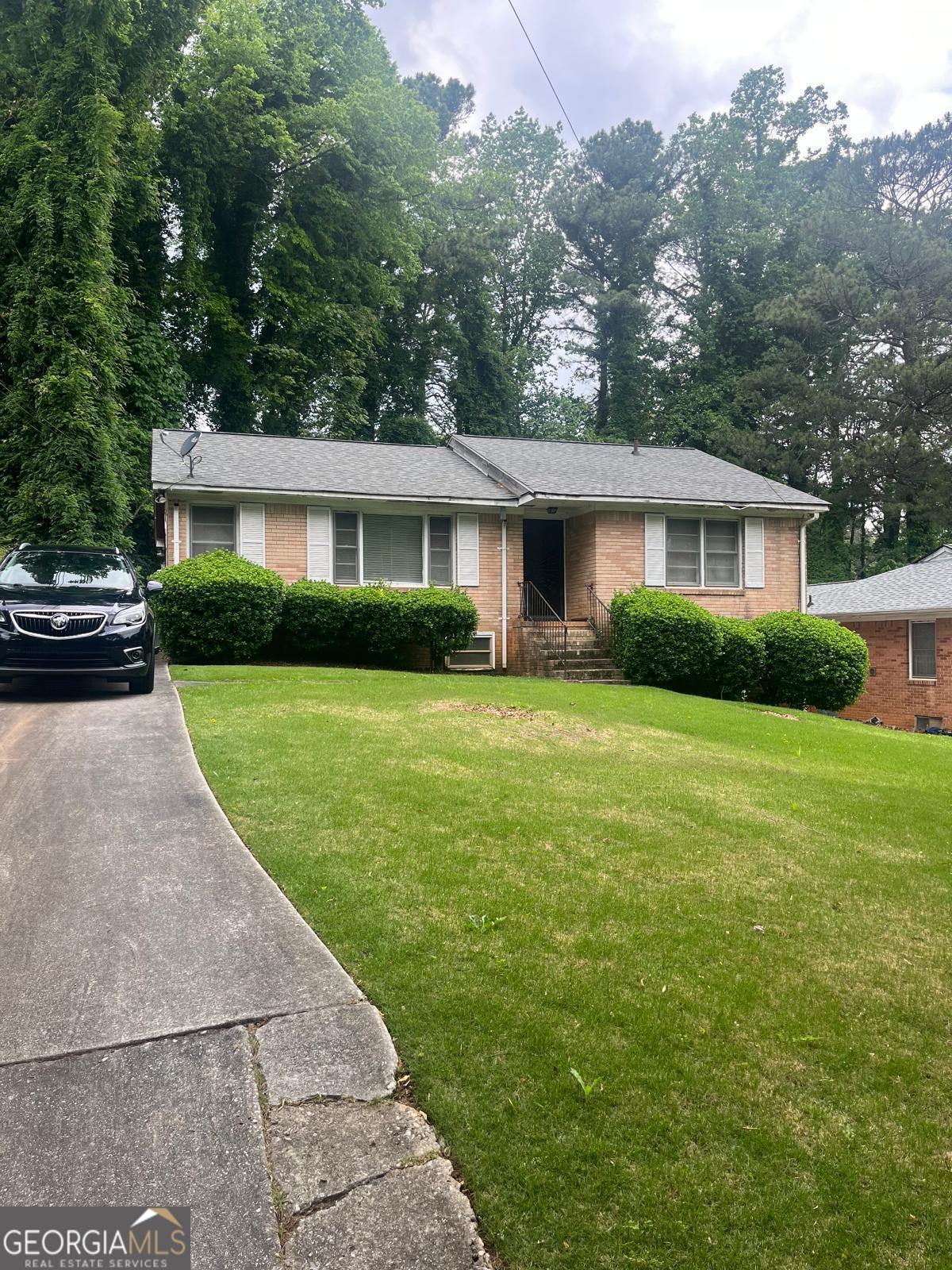 front view of a house and a yard