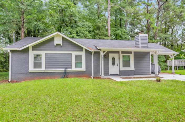 front view of a house with a yard