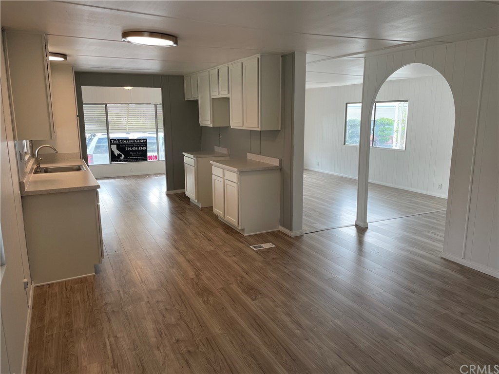 wooden floor in kitchen and a windows in a kitchen