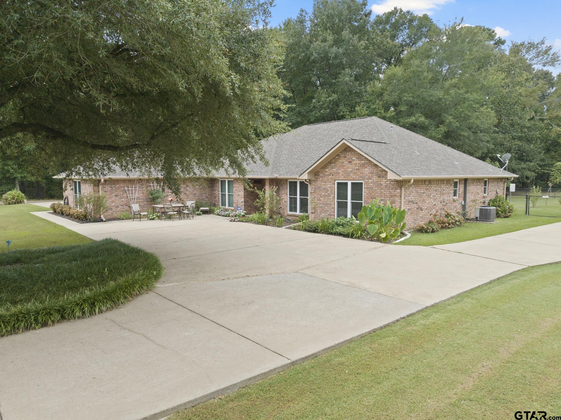 a house with trees in the background