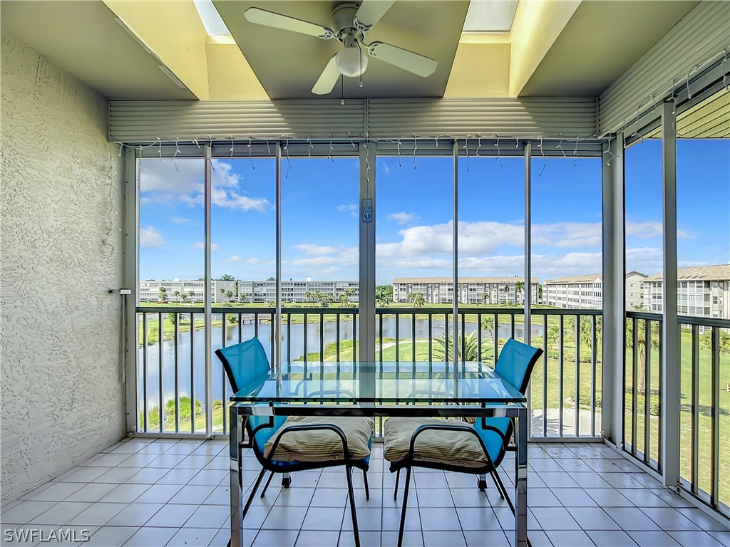 a roof deck with a table and chairs