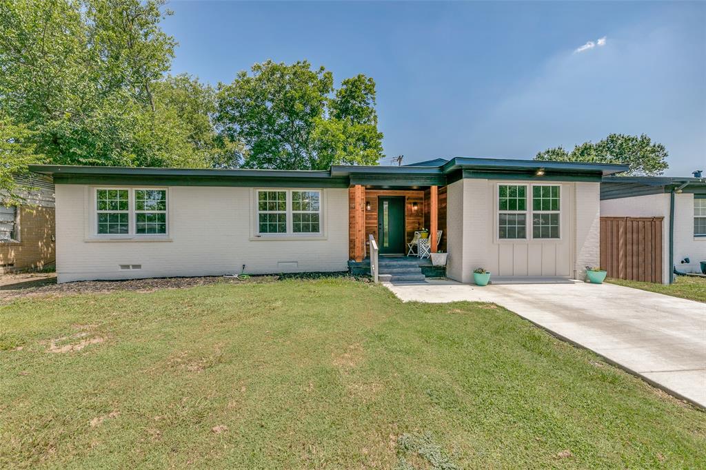 front view of a house with a yard