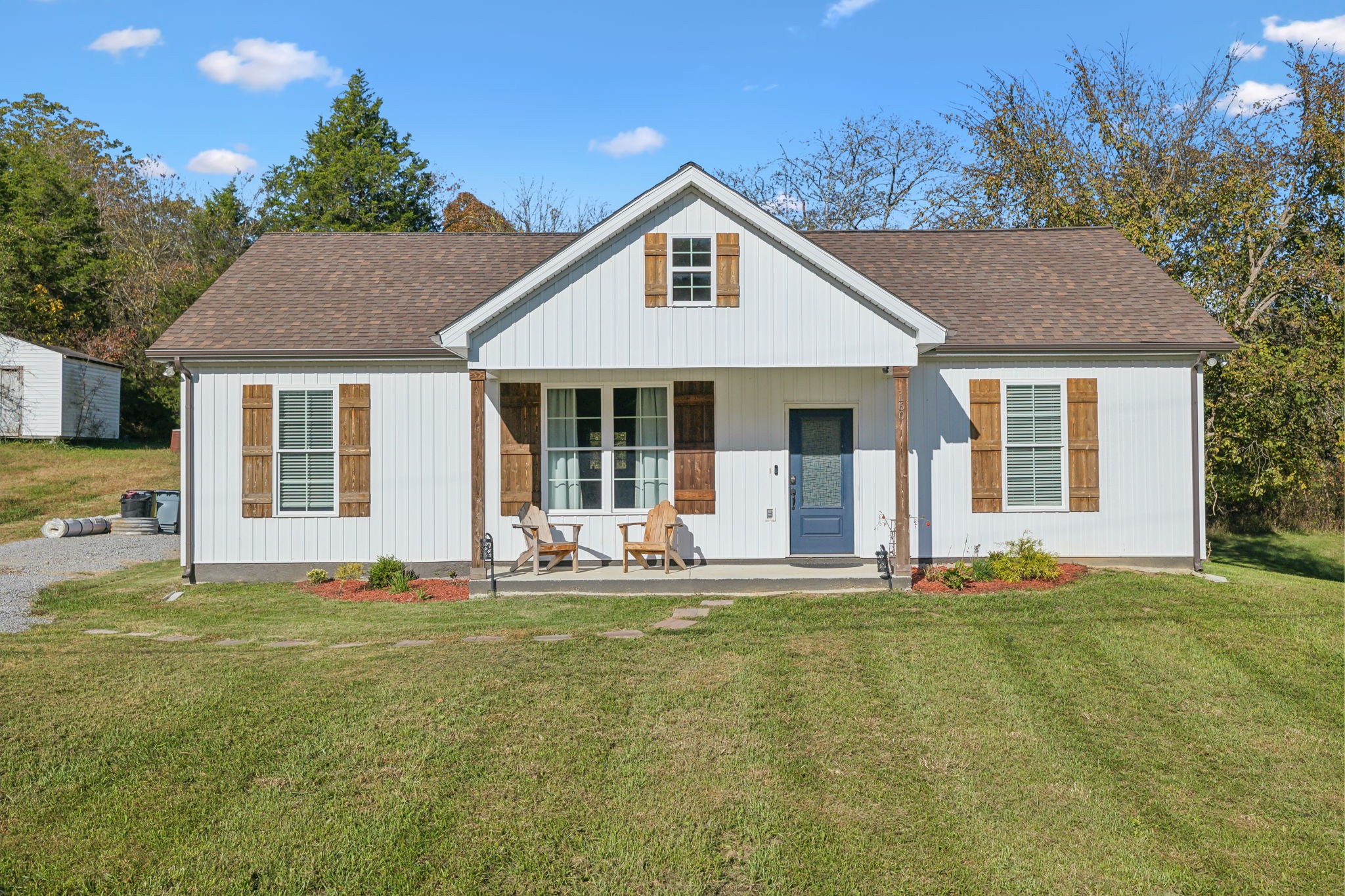 a front view of a house with a yard