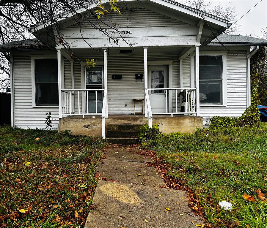 front view of a house with a small yard