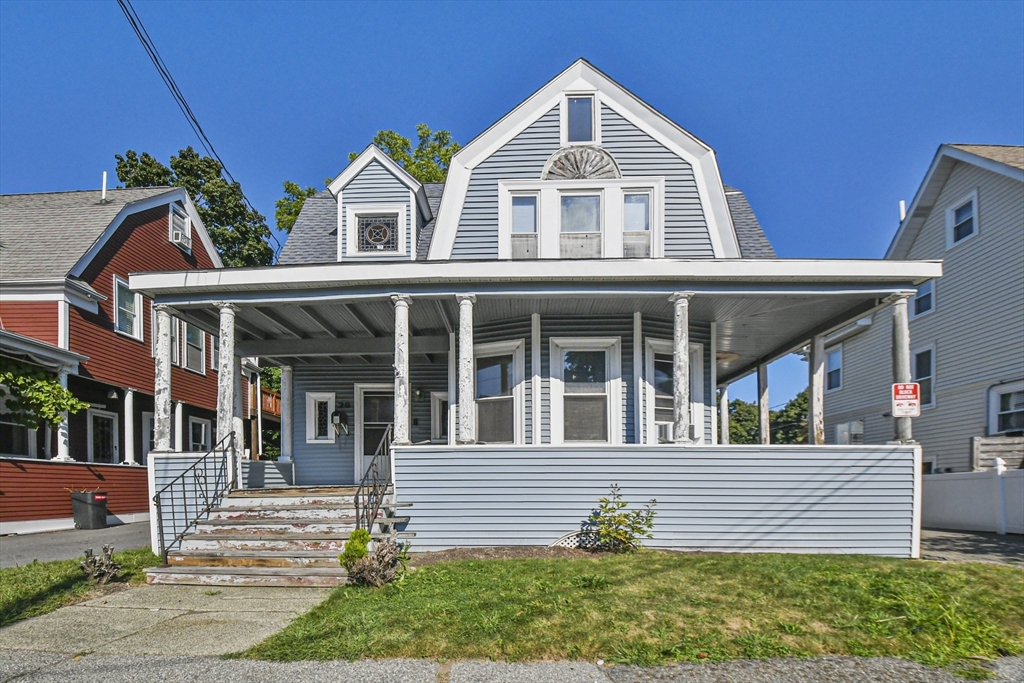 front view of a house with a yard