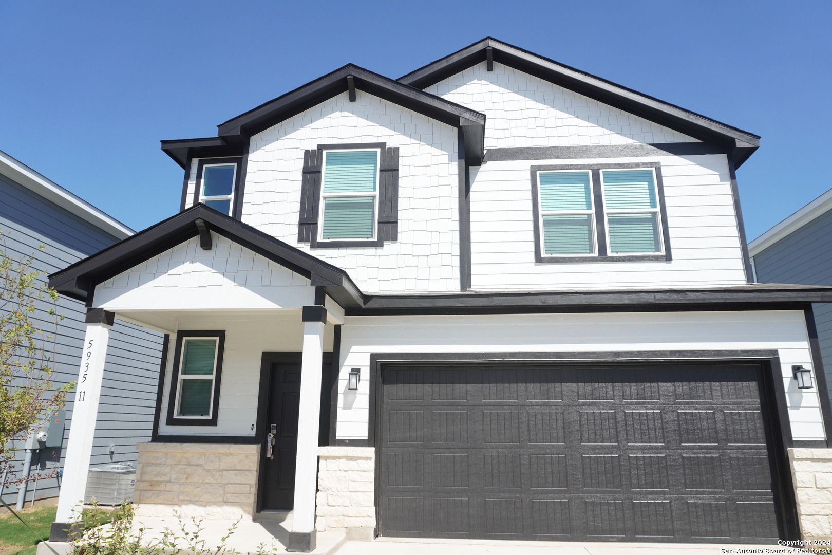 a front view of a house with a garage