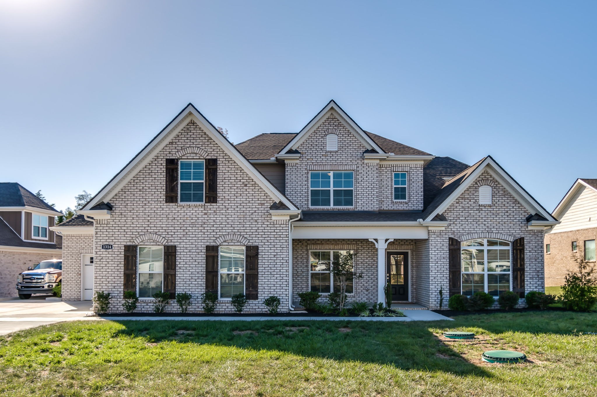 a front view of a house with a yard