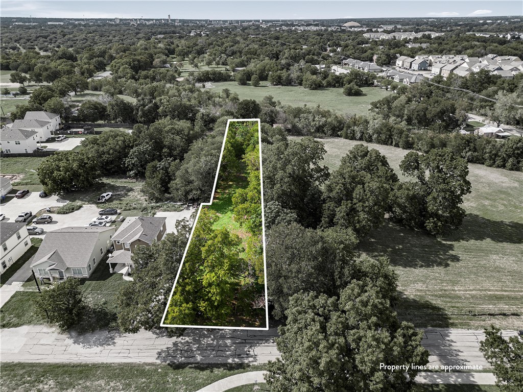 an aerial view of residential house with outdoor space