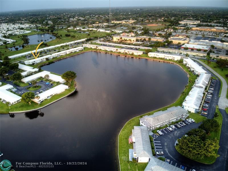 an aerial view of a residential houses with outdoor space