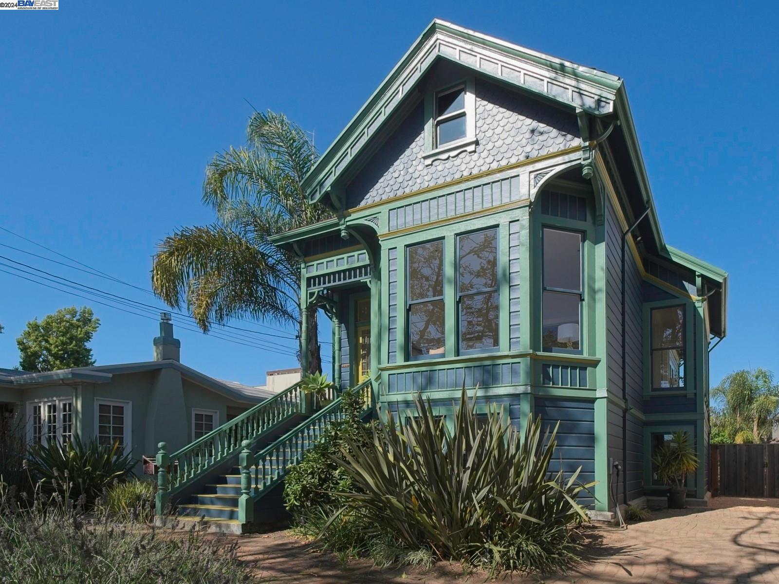 a view of a house with a small yard and plants