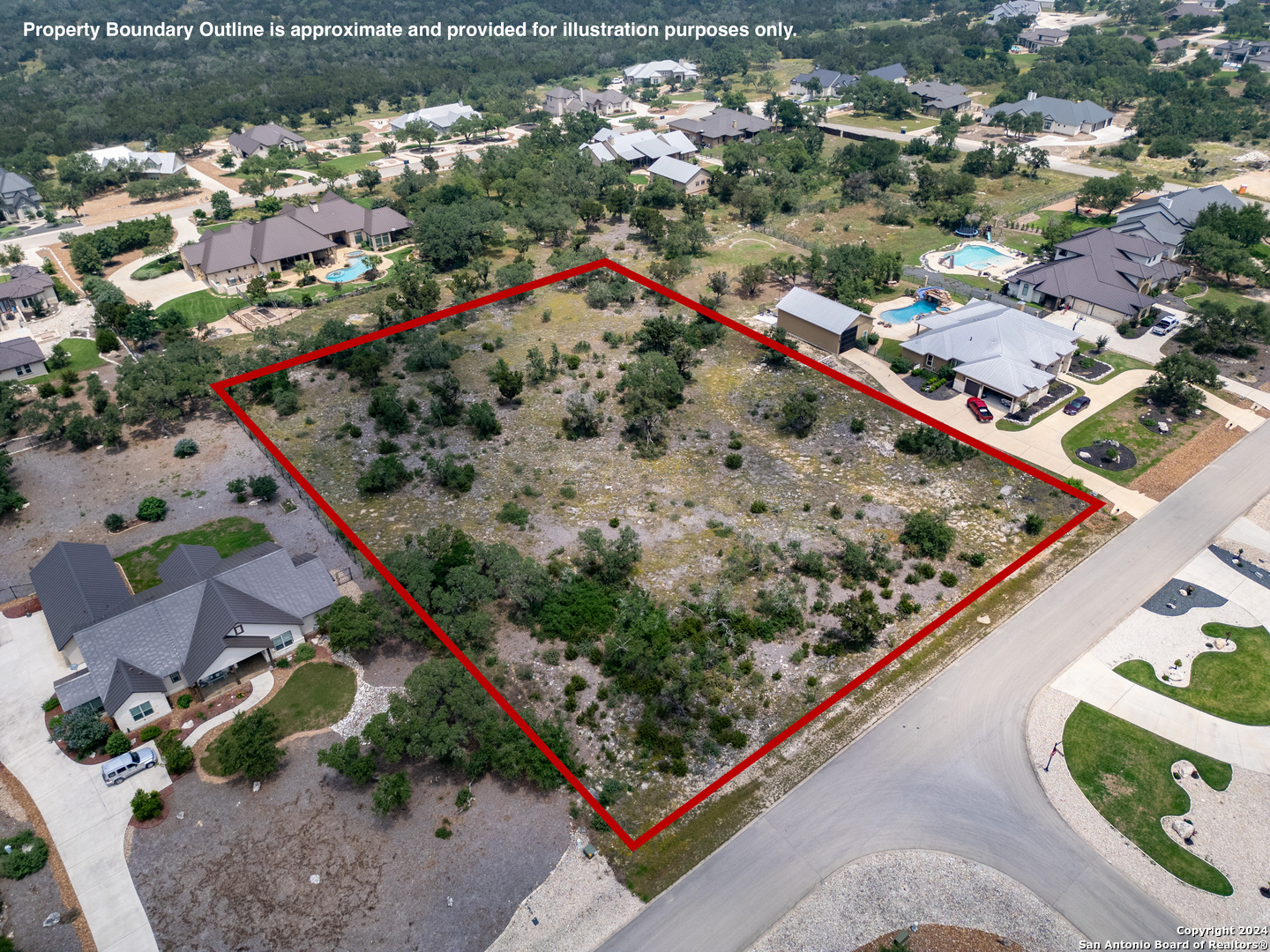 an aerial view of a residential houses with outdoor space