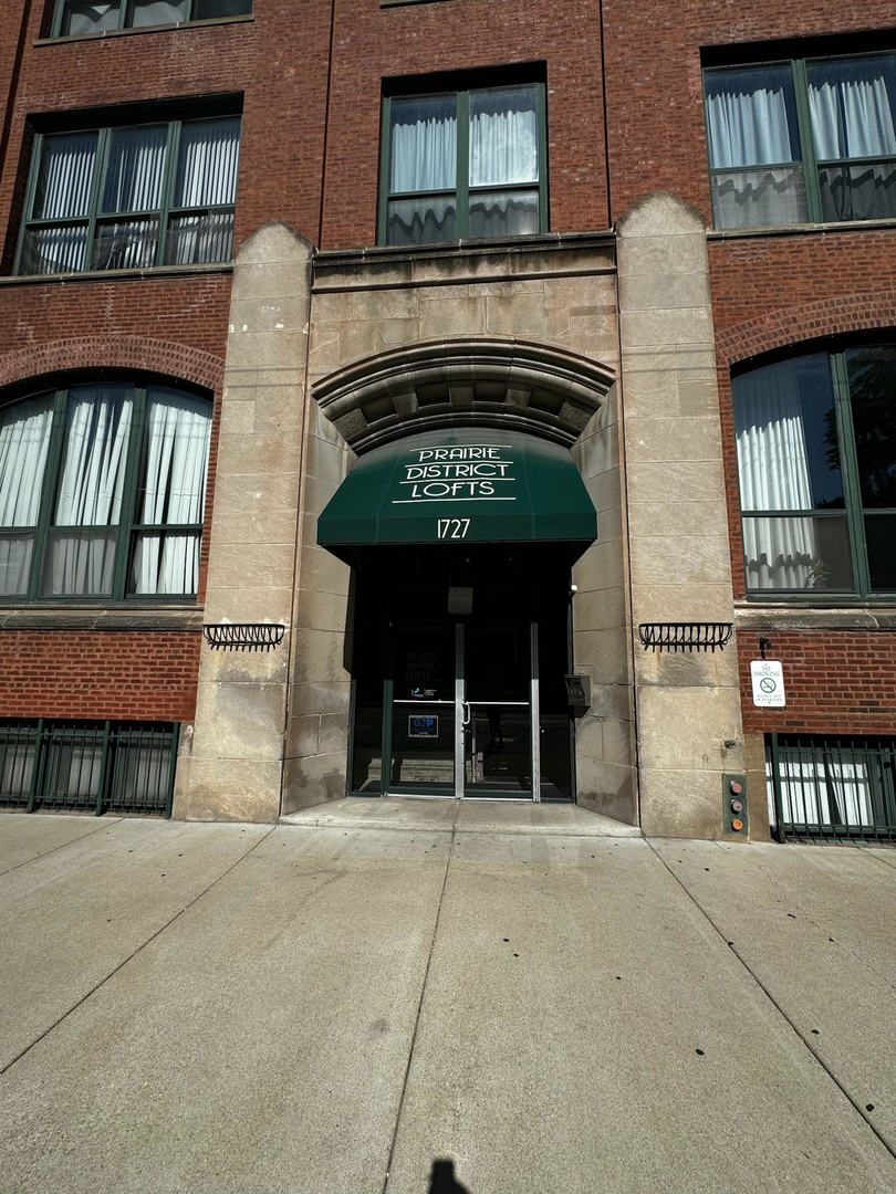 a front view of a building with a garage