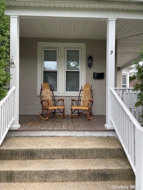 a view of hall way with furniture