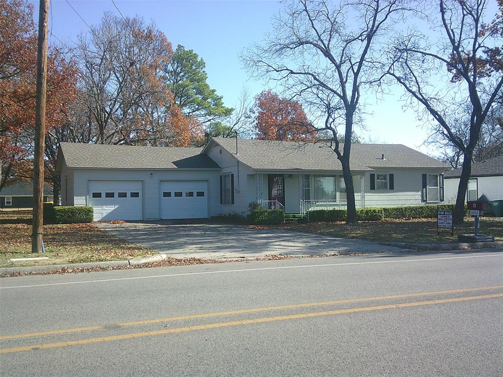 a view of a house small that has a clock on it