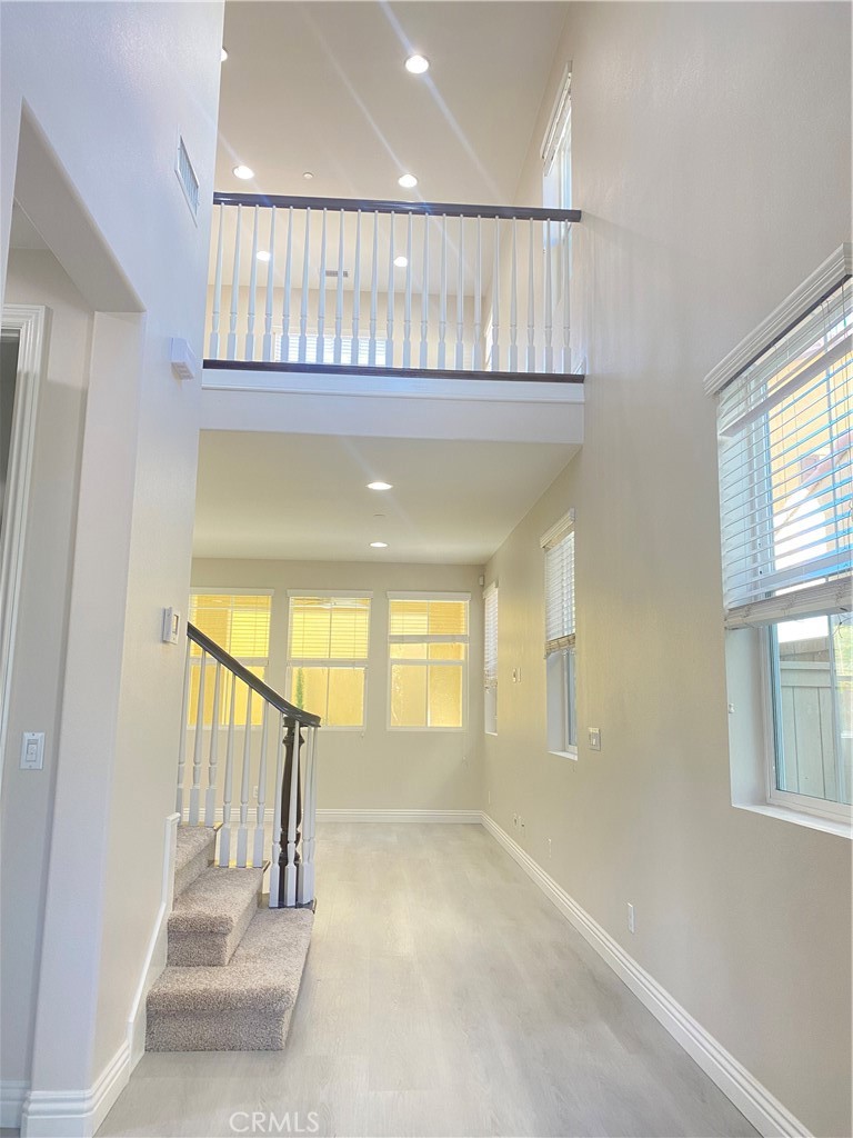 a view of an entryway with wooden floor