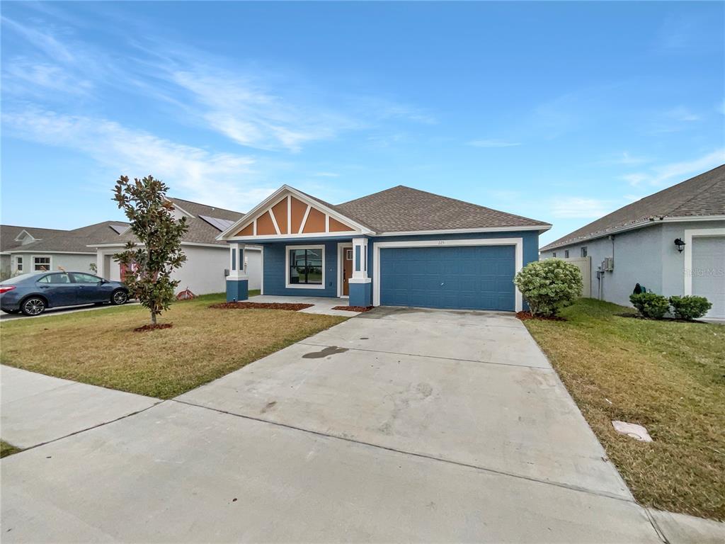 front view of a house with a yard