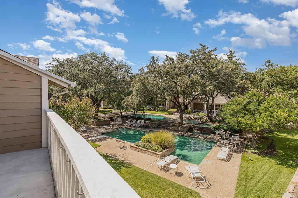 a view of a backyard with sitting area