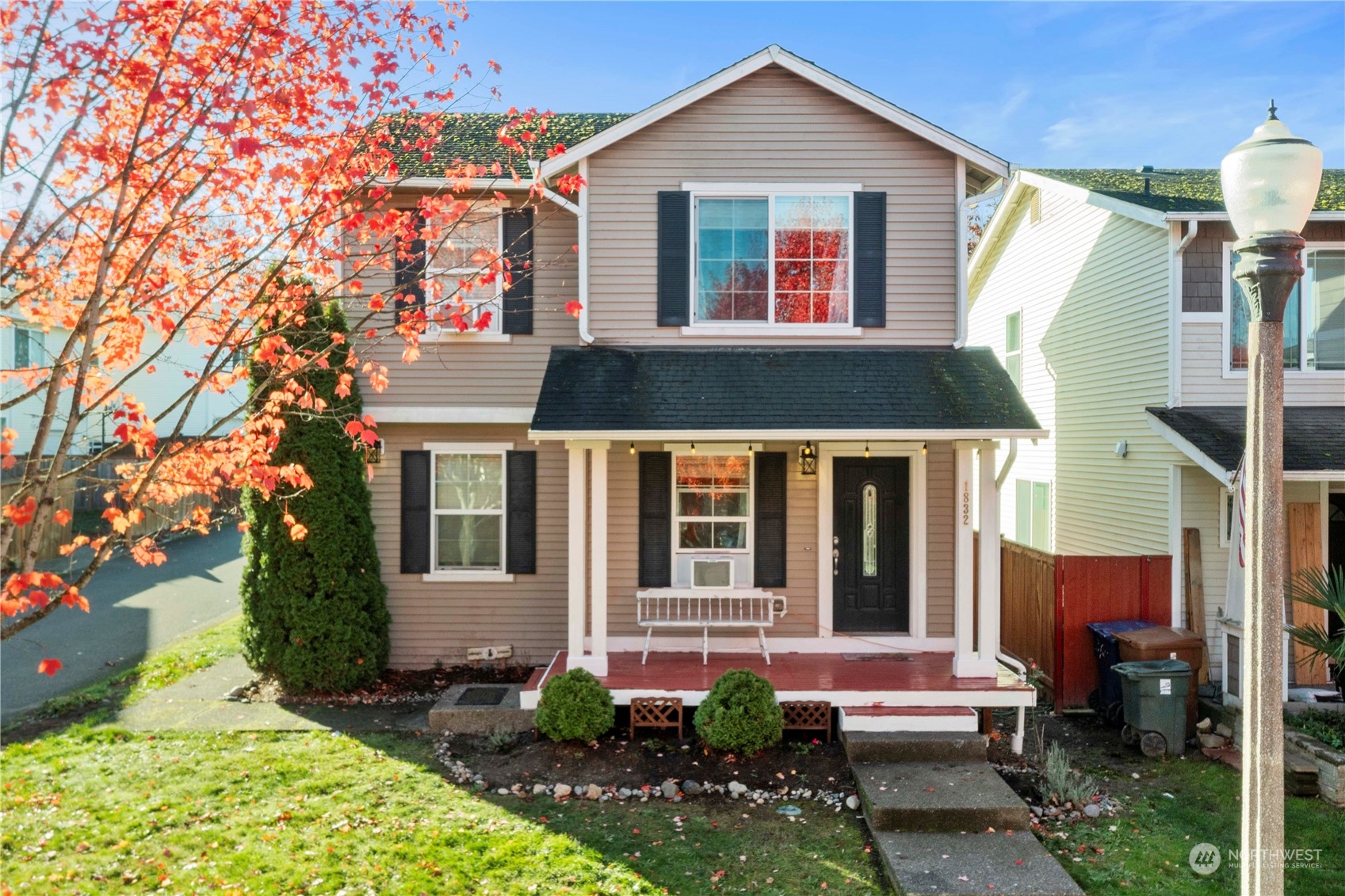 a front view of a house with a yard