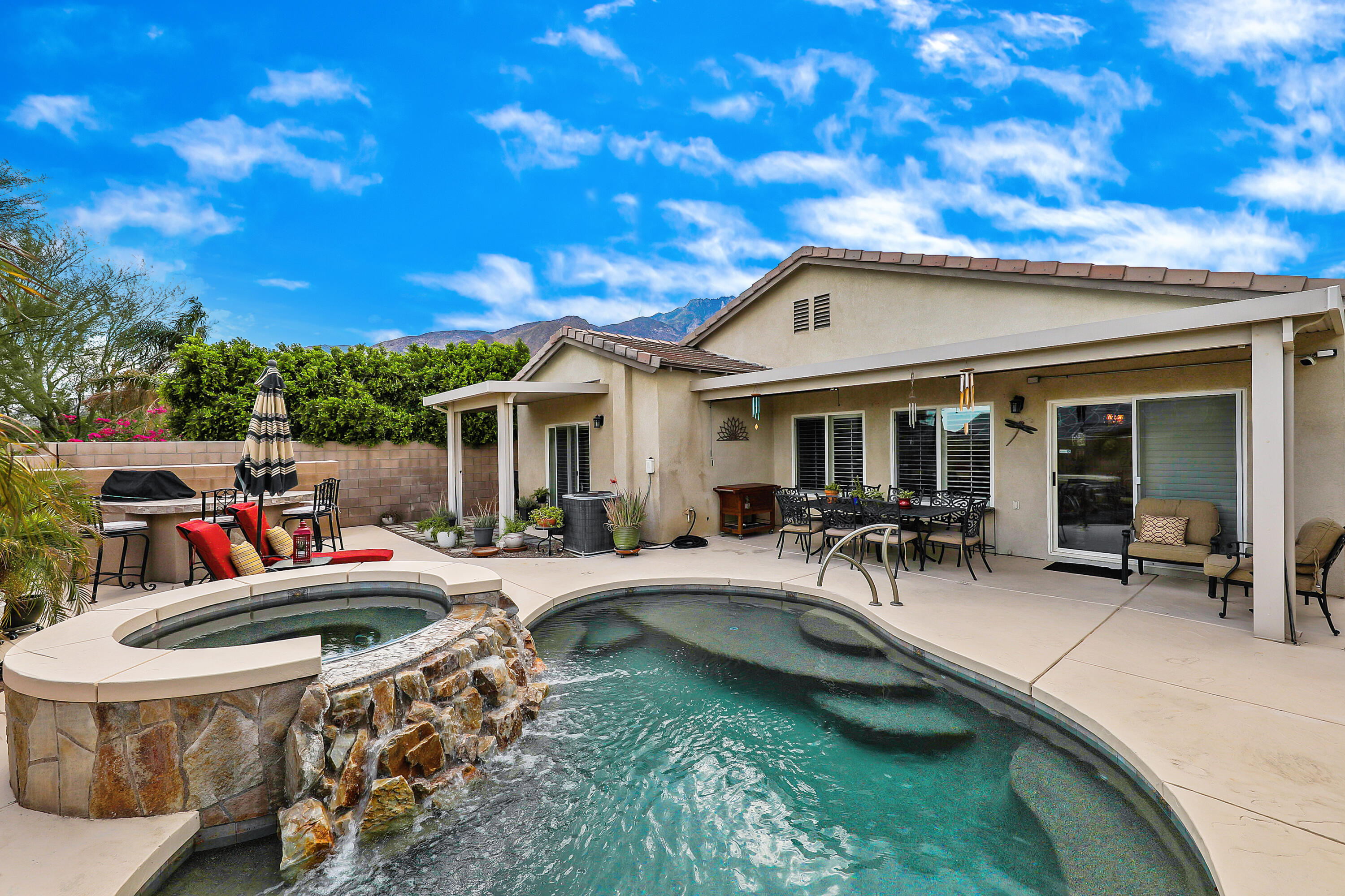 a front view of house with yard outdoor seating and barbeque oven