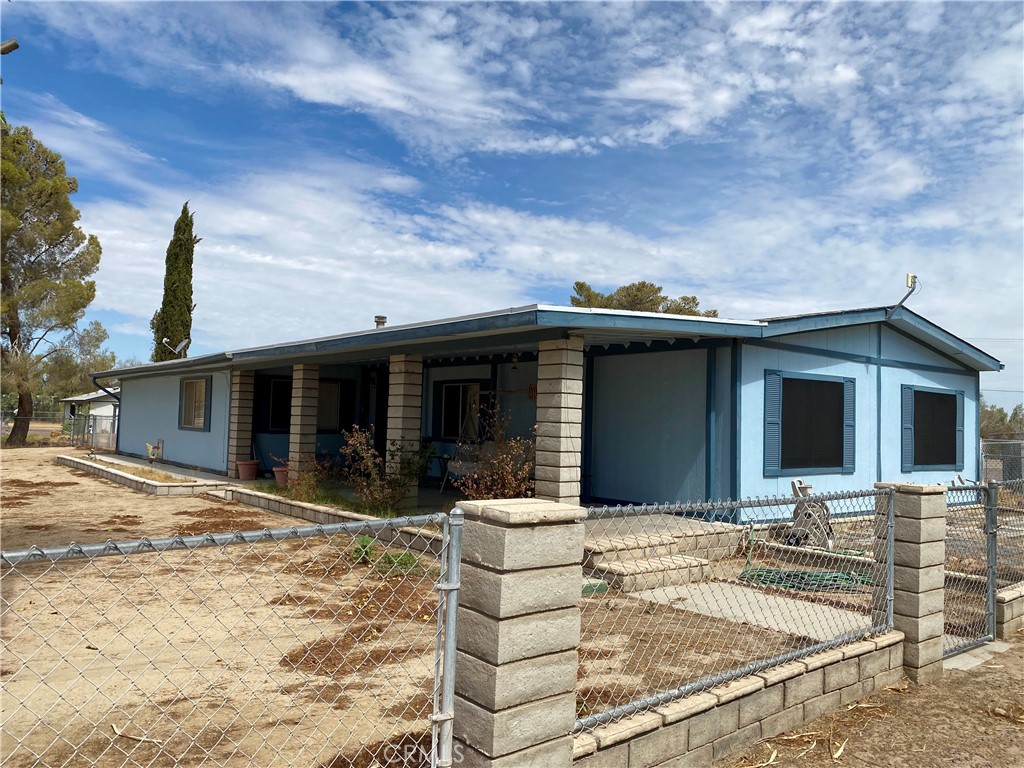 a front view of a house with a patio