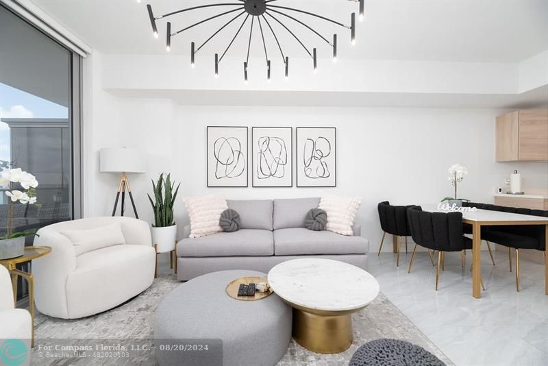 a living room with furniture a couch and a potted plant